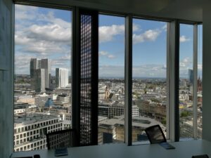 Coworking with skyline view - Panorama views over the city of Frankfurt and the Financial District