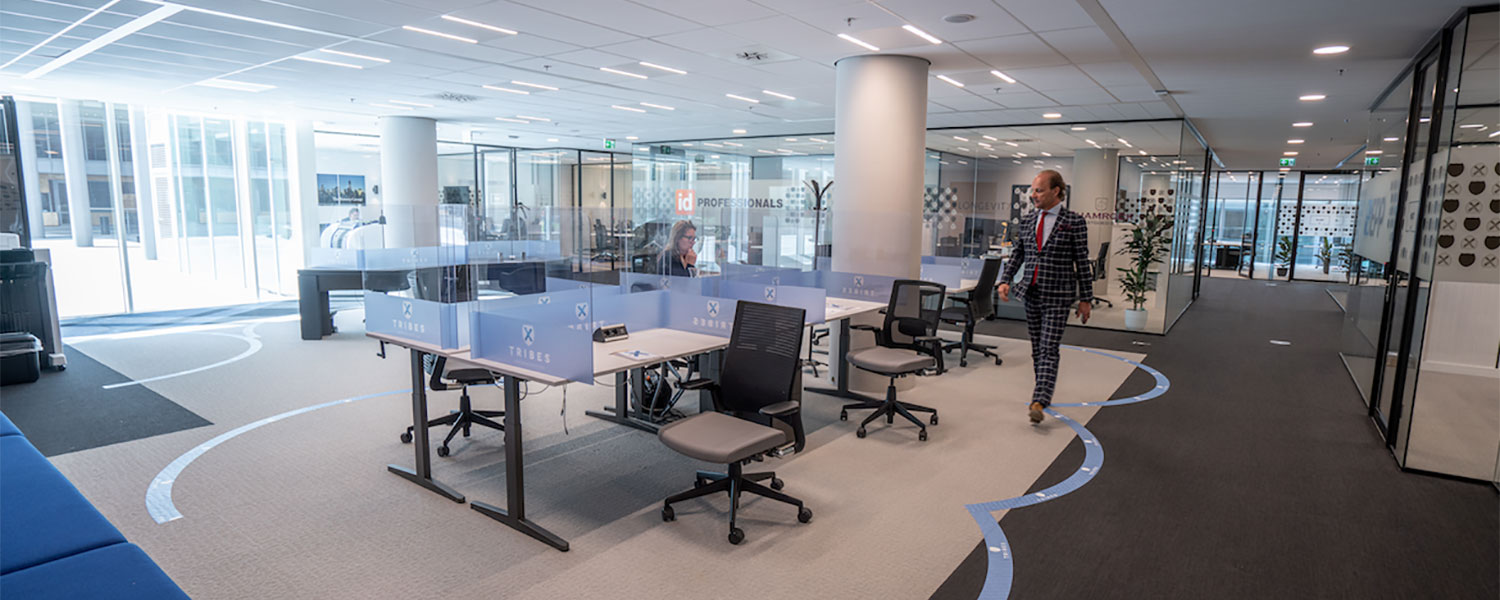 Tribes Coworking Office - Eduard Schaepman walking through the rental offices and the blue marked zones